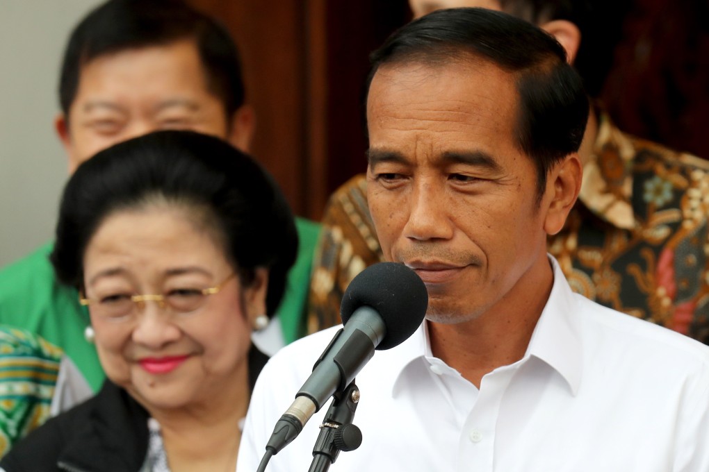 Indonesian President Joko Widodo pictured alongside Megawati Sukarnoputri (L) during a press conference in Jakarta in 2019. Photo: EPA-EFE
