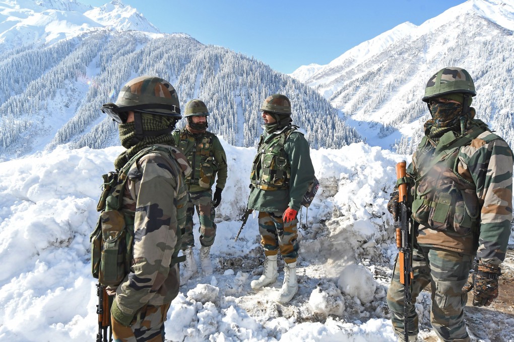 Indian soldiers stand on a snow-covered road near Zojila mountain pass that connects Srinagar to Ladakh, bordering China. File photo: AFP via Getty Images/TNS