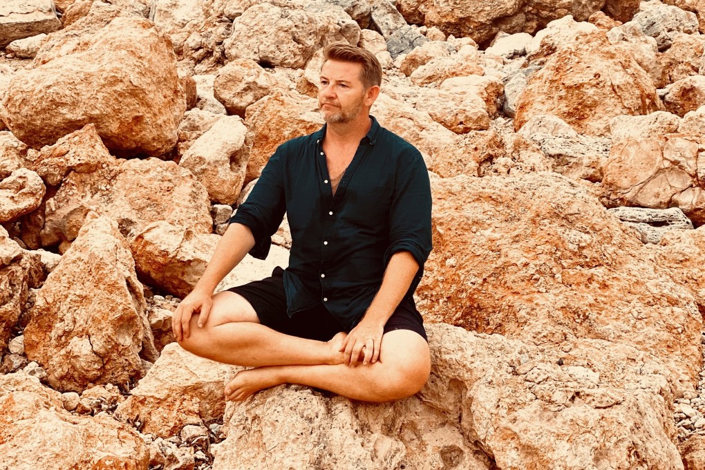 Chris Connors meditates in Ibiza, Spain. As well as running expensive retreats there for executives, the former fashion entrepreneur has developed a free app called OPO to share the benefits of meditation with more people. Photo: Chris Connors