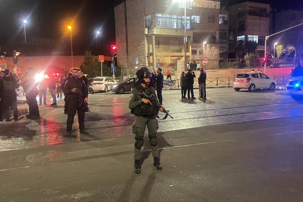 Emergency services and security personnel work at the scene of a shooting at a synagogue in Jerusalem on Friday. Photo: EPA-EFE