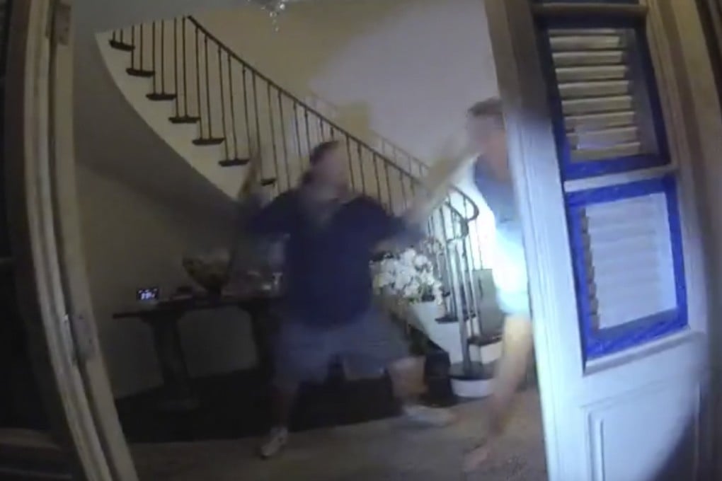 Police body camera footage shows Paul Pelosi (right) fighting for control of a hammer with his assailant during a brutal attack at his San Francisco home in October 2022. Photo: San Francisco Police Department via AP