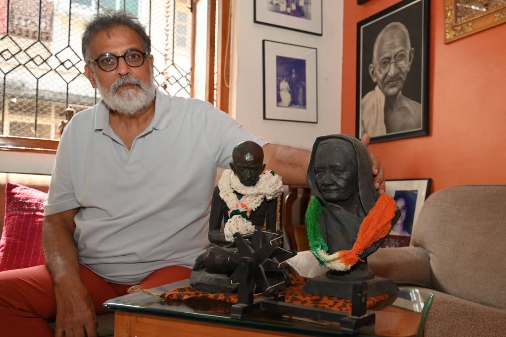 Indian author Tushar Gandhi with a bust of his great-grandfather Mahatma Gandhi at his home in Mumbai. Photo: AFP