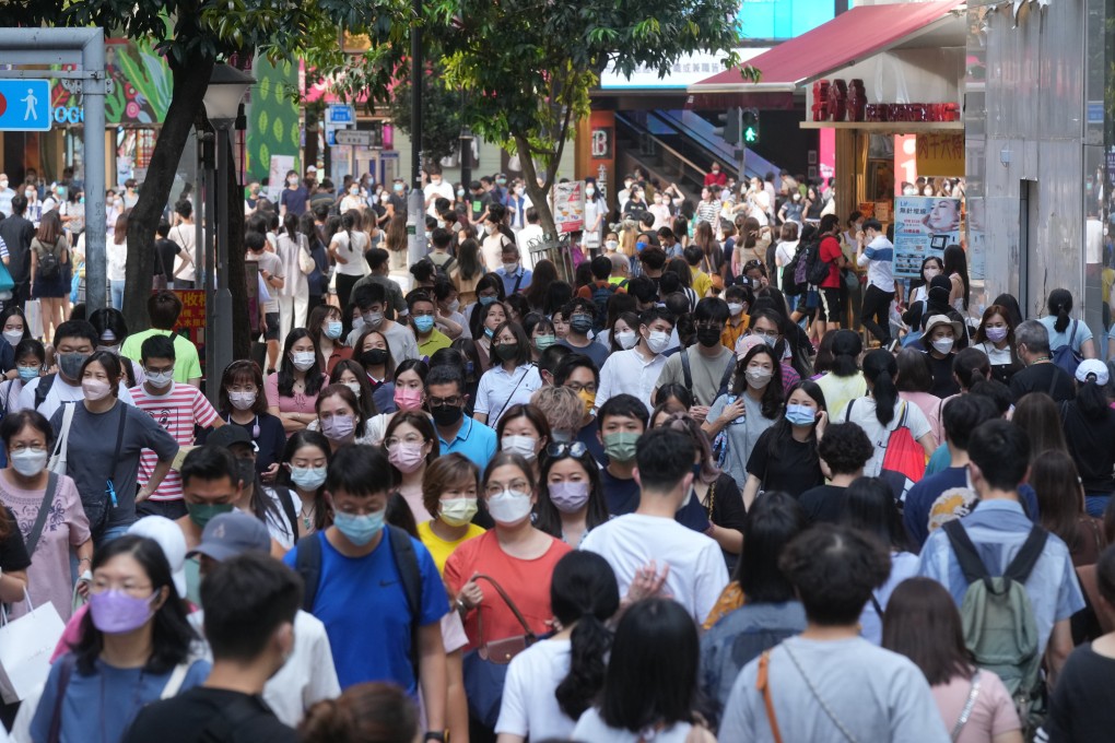 Crowds in Causeway Bay on August 7 last year. A number of economists have made it clear they feel the universal distribution of consumption vouchers is no longer necessary. Photo: Sam Tsang