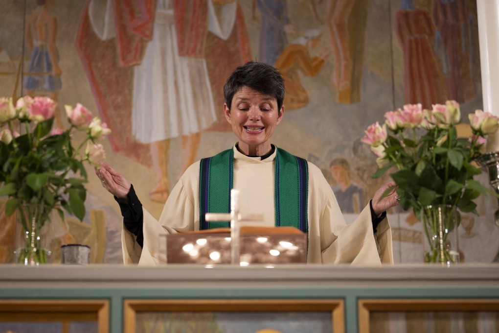 The Reverend Siv Limstrand celebrates evening service with congregants at Svalbard Church in Longyearbyen, Norway, on January 10, 2023. “We pray every Sunday for everyone who’s affected by climate change,” she says. Photo: AP