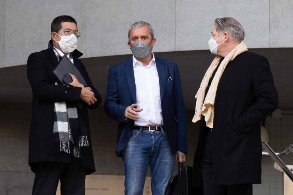 Michel Gonzalez (middle) with his lawyers outside Kowloon City Court. Photo: Brian Wong