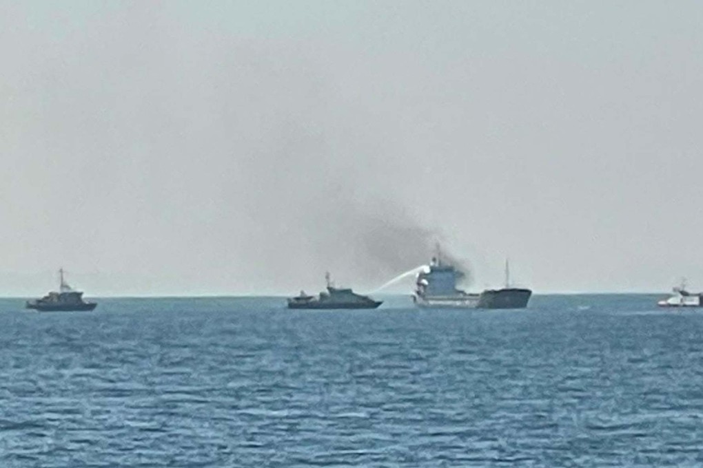 A fireboat uses a water jet to fight the blaze on the cargo ship. Photo: Facebook