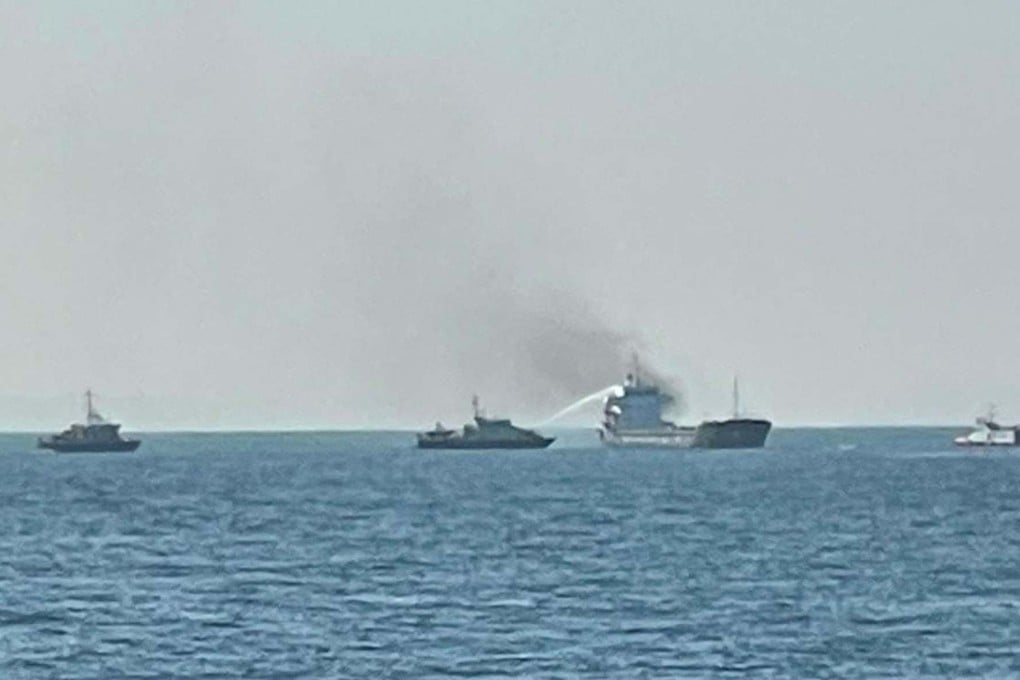 A fireboat uses a water jet to fight the blaze on the cargo ship. Photo: Facebook