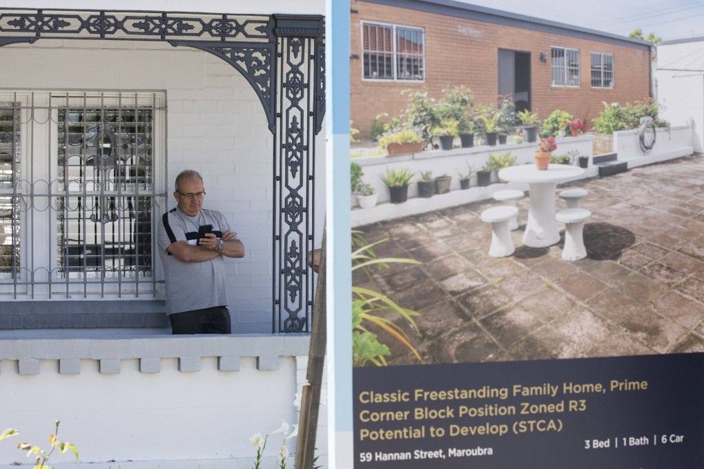 A man waits for a residential home auction to start in the Maroubra area in Sydney, Australia, on November 12, 2022. Australia’s housing market has held up relatively well in the face of a record-breaking fall in prices, defying expectations of a housing bust. Photo: Bloomberg