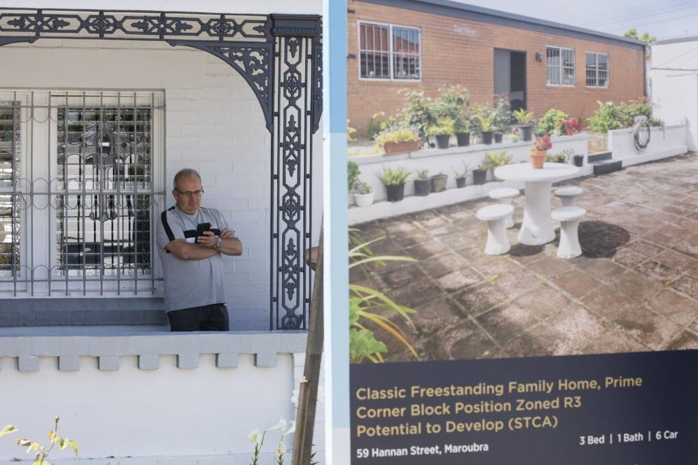 A man waits for a residential home auction to start in the Maroubra area in Sydney, Australia, on November 12, 2022. Australia’s housing market has held up relatively well in the face of a record-breaking fall in prices, defying expectations of a housing bust. Photo: Bloomberg