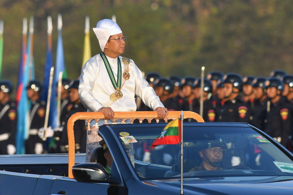Myanmar junta chief Min Aung Hlaing stands in a car as he oversees a military display to mark the country’s Independence Day in Naypyidaw earlier this month. Photo: AFP
