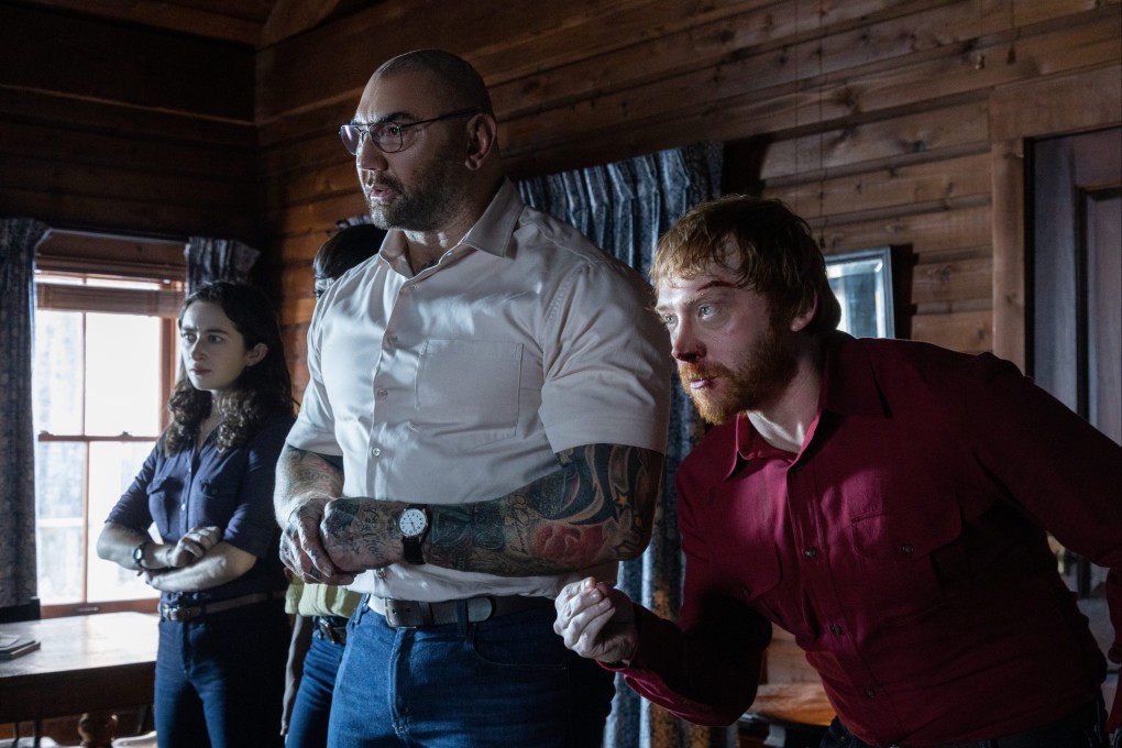 (From left) Abby Quinn, Dave Bautista and Rupert Grint in a still from Knock at the Cabin (category IIB), directed by M. Night Shyamalan.