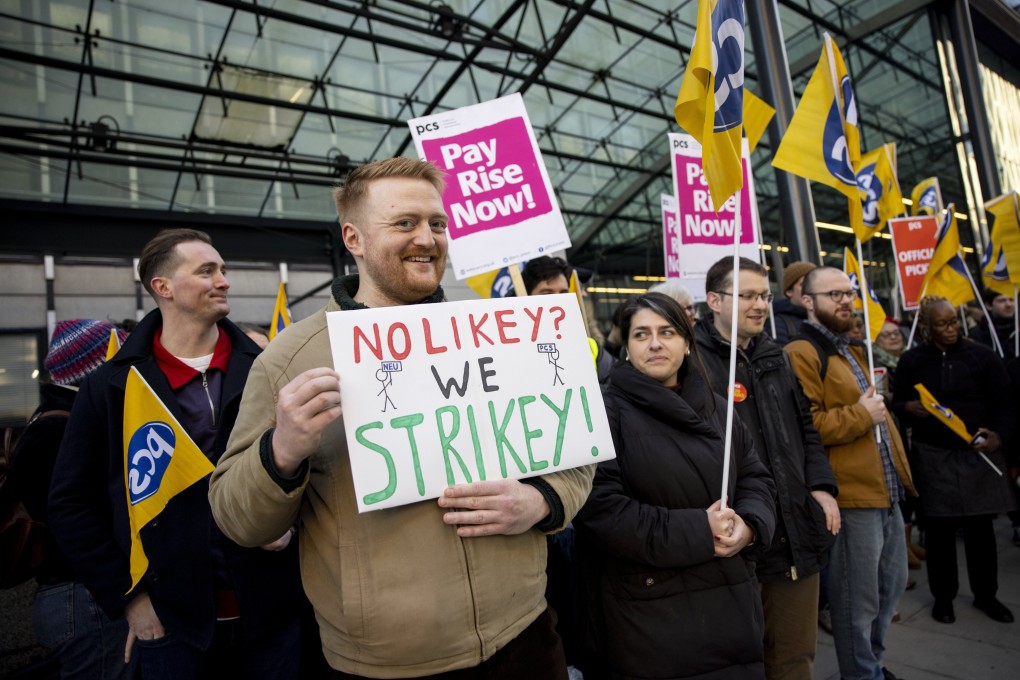 Civil servants join a picket line in London on Wednesday. Photo: EPA-EFE