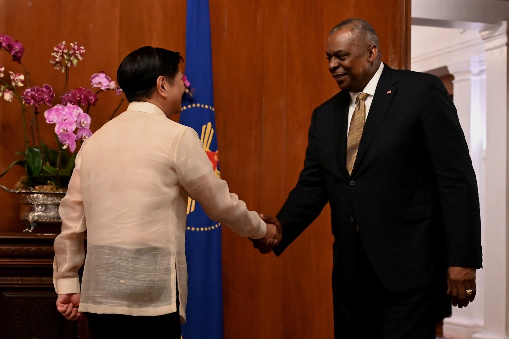 US Defence Secretary Lloyd Austin (right) shakes hands with Philippines President Ferdinand Marcos Jnr at the presidential palace in Manila on Thursday. Photo: Reuters