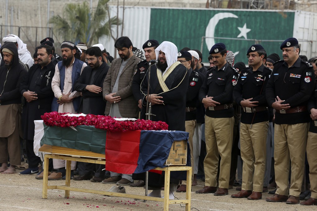 Police officials attend the funeral prayer of a police officer, a victim of Monday’s suicide bombing, in Peshawar, Pakistan. Photo: AP