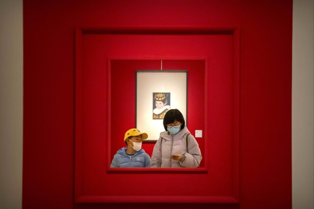 A woman and child walk through a gallery at the National Art Museum of China in Beijing on February 1. Three years of Covid-19 have exacerbated the urban-rural divide and worsened income inequality. Photo: AP