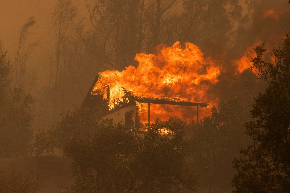A burning house during a fire near the city of Santa Juana, Chile on Saturday. Photo: EPA-EFE