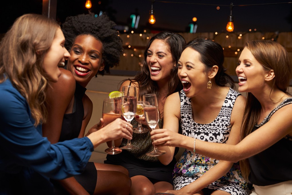 A group of women drinking. Sommelier Yulia Ezhikova shares five ways you can rethink your approach to alcohol and drinking, from no-alcohol days to keeping stress levels in check. Photo: Shutterstock