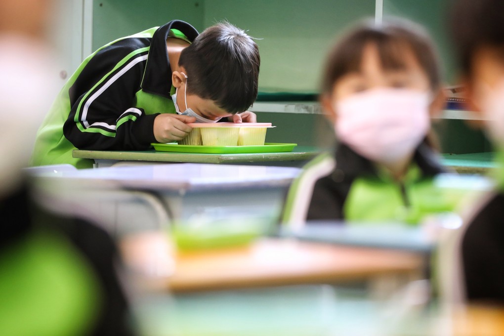 Pupils eat lunch at their desks after returning to full-day in-person learning on December 1 last year at a school in Tsing Yi. Photo: Elson Li