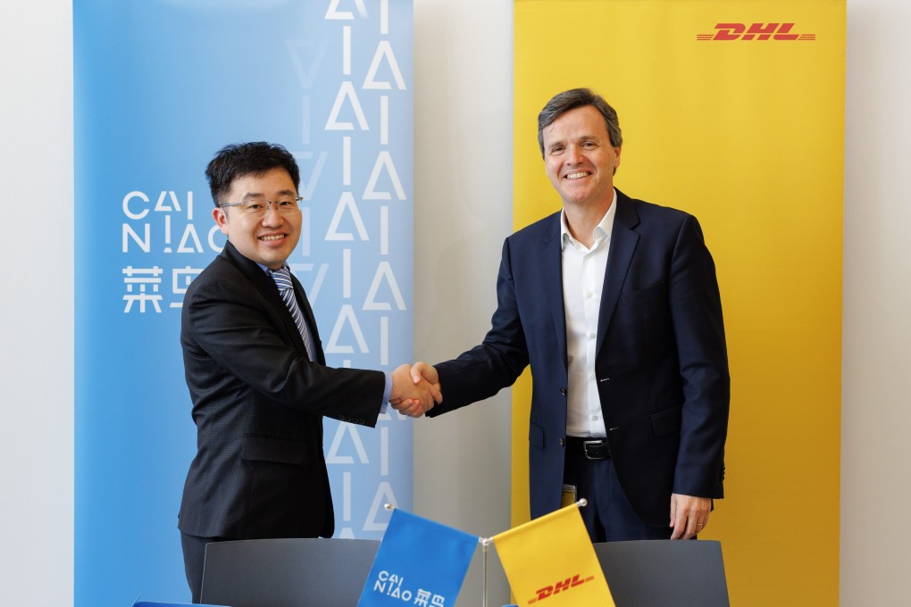 William Xiong (left), Cainiao’s chief strategy officer and general manager for Europe and Southeast Asia, signs an agreement with Pablo Ciano, CEO of DHL eCommerce Solutions, that will see the companies combine their parcel locker networks in Poland. Photo: Handout