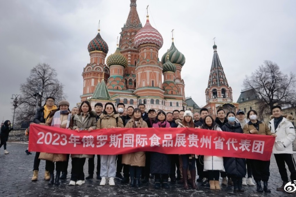 The business delegation from Guizhou province poses in front of St Basil’s Cathdral in Moscow’s Red Square. Photo: Weibo