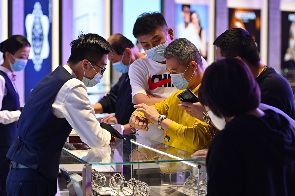 China’s wealthiest consumers will continue to splurge on luxury items like designer bags and watches as the economy reopens, says Bain & Company. Photo: Xinhua