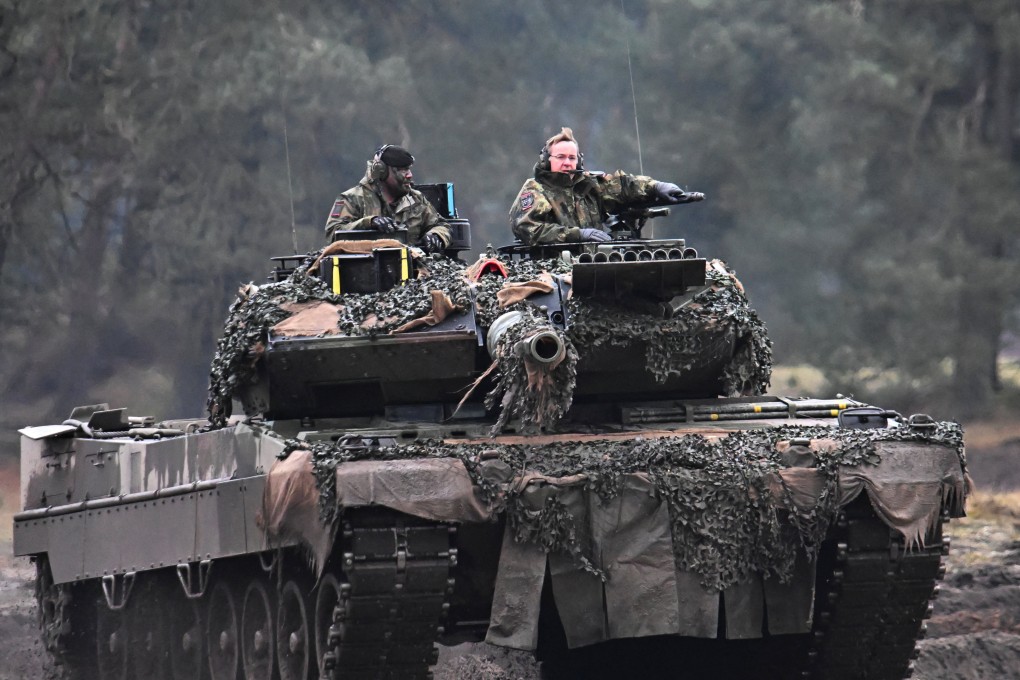 German Defence Minister Boris Pistorius rides a tank as he visits the Leopard 2 vehicles that are due to be supplied to Ukraine in Augustdorf, Germany on February 1. Photo: Reuters