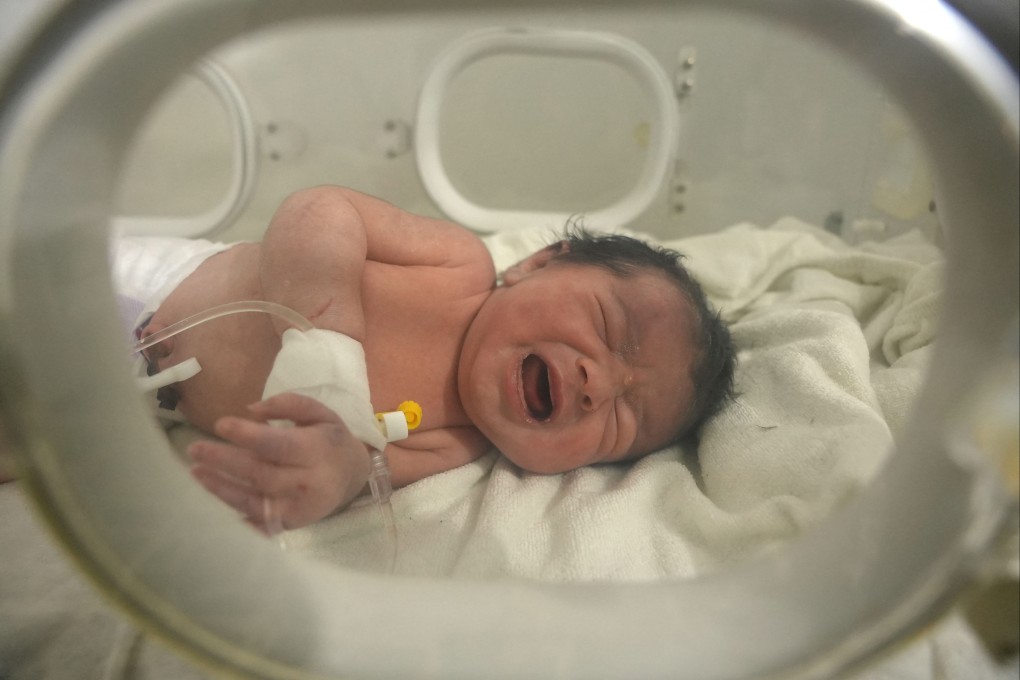 A newborn baby who was found in the rubble of a home in northern Syria following a deadly earthquake receives medical care at a clinic in Afrin on Tuesday. Photo: AFP