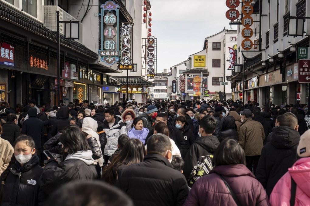 Shoppers in the Guanqian Street shopping area in Suzhou, Jiangsu province, on January 25. China’s Lunar New Year travel and box office figures showed promising returns, adding to evidence that the country’s economic recovery could be around for the long haul. Photo: Bloomberg