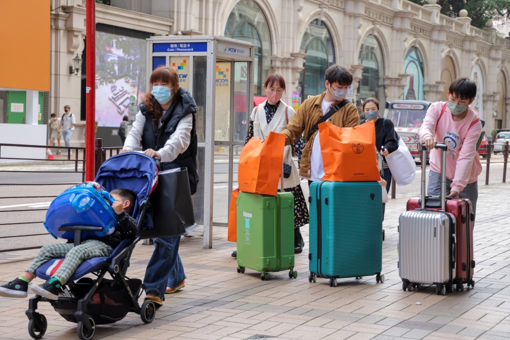 Tourists walk along Canton Road in Tsim Sha Tsui on the first day of a full reopening of the border between Hong Kong and mainland China on Monday. 
Photo: Jelly Tse