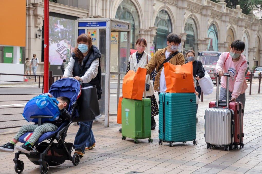 Tourists walk along Canton Road in Tsim Sha Tsui on the first day of a full reopening of the border between Hong Kong and mainland China on Monday.
Photo: Jelly Tse