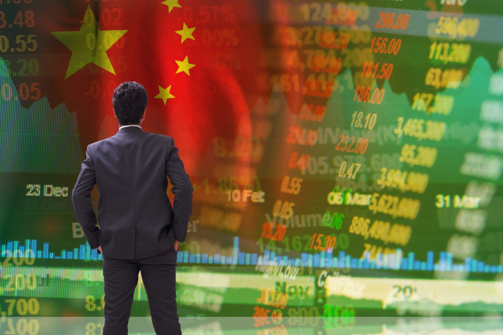 A businessman standing in front of Chinese stock tickers. Photo: Shutterstock Images