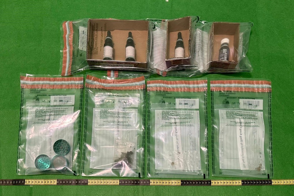 Customs officers display seized CBD products from first arrest under new ban. Photo: Handout