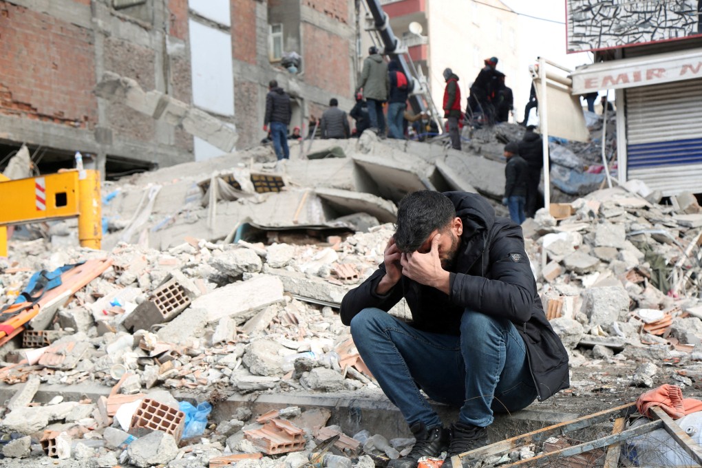 A man reacts at the site of a collapsed building after a deadly earthquake in Diyarbakir, Turkey. The unfolding disaster demands a rapid and focused global response to help victims. Photo: Reuters