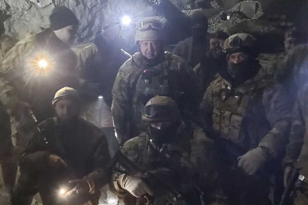 Wagner fighters and their boss Yevgeny Prigozhin pose for a picture in a salt mine in Soledar, Ukraine. Photo: Press service of ‘Concord’ via Reuters