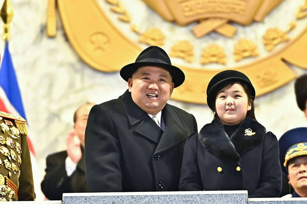 North Korean leader Kim Jong-un and his daughter attending a military parade . Photo: AFP