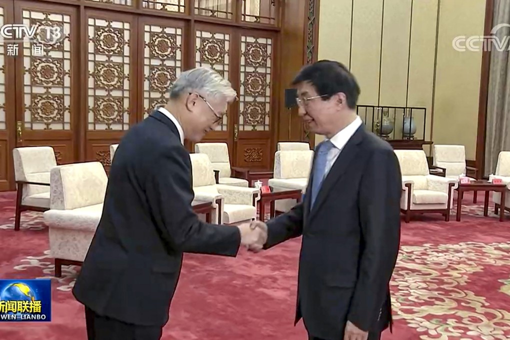 Wang Huning (right) receives Kuomintang vice-chairman Andrew Hsia in Beijing on Friday. Photo: CCTV