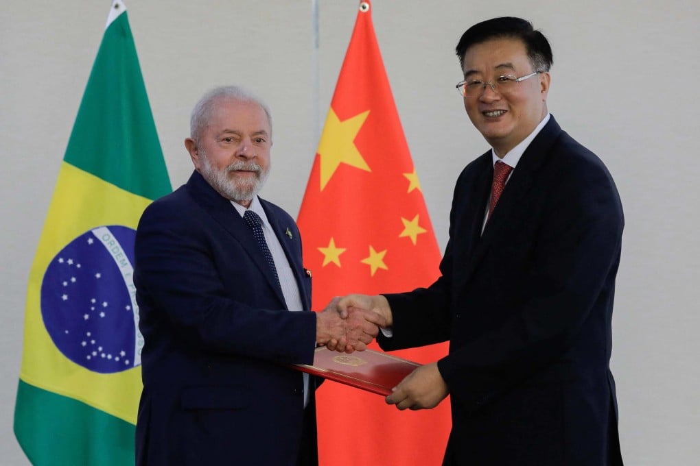 President Luiz Inacio Lula da Silva of Brazil with China’s ambassador to Brazil, Zhu Qingqiao. Photo: AFP