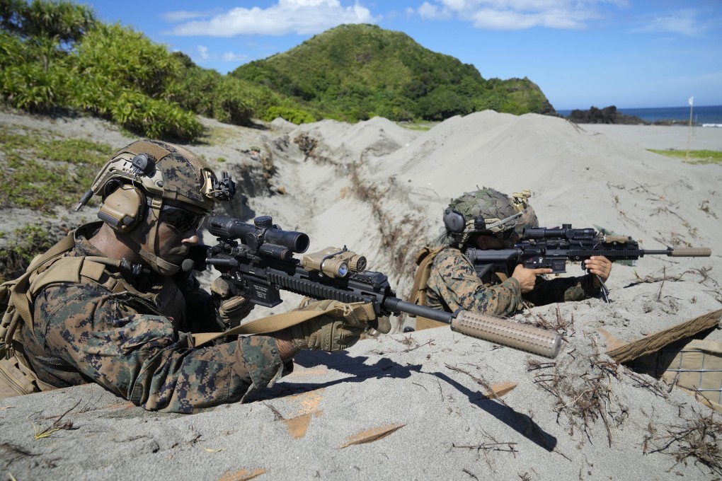 US Marines take their position in a trench during a joint exercise with  the Philippines last year. The US Marine Corps last month opened its first new base in 70 years in Guam. Photo: AP