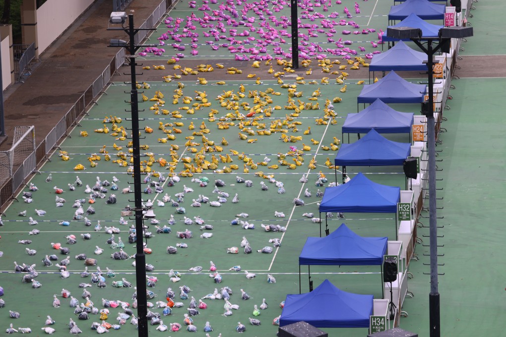 Baggage deposit service at Victoria Park provided for runners entered in the 25th Standard Chartered Hong Kong Marathon. Photo: Dickson Lee