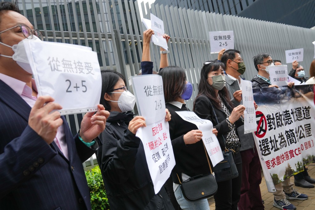 Kai Tak residents protest outside the government headquarters in Tamar against the proposed light public housing in their neighbourhood on February 7. Residents have argued there is not enough transport capacity to handle more people and the proposed buildings would block views from certain sites. Photo: Sam Tsang