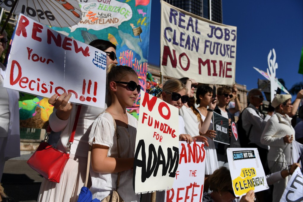 Environmental activists voice their opposition to Adani’s proposed Carmichael coal mine, outside Parliament House in Brisbane, on May 25, 2017. Photo: EPA