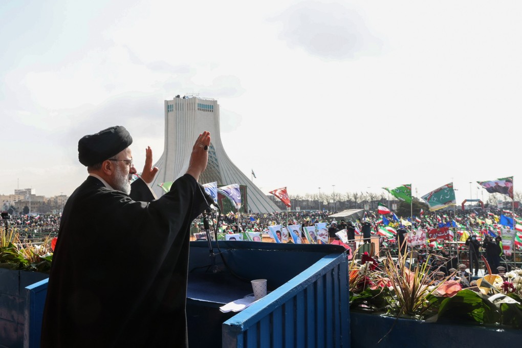 Iranian President Ebrahim Raisi greets the crowd  during the 44th anniversary of the 1979 Islamic Revolution, at the Azadi square in Tehran. Photo: EPA-EFE