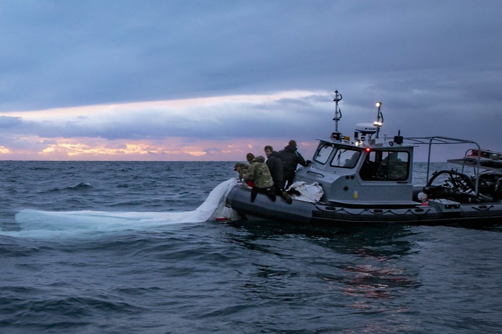 US Navy sailors recover a high-altitude surveillance balloon off the coast of Myrtle Beach, South Carolina, on Sunday after it was shot down by the US army. Photo: US Navy via AFP