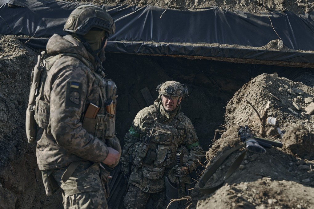 Soldiers of the Ukrainian 3rd Army Assault Brigade of the Special Operations Forces (SSO) “Azov” by a trench in position near Bakhmut, Donetsk region, Ukraine. Photo:AP
