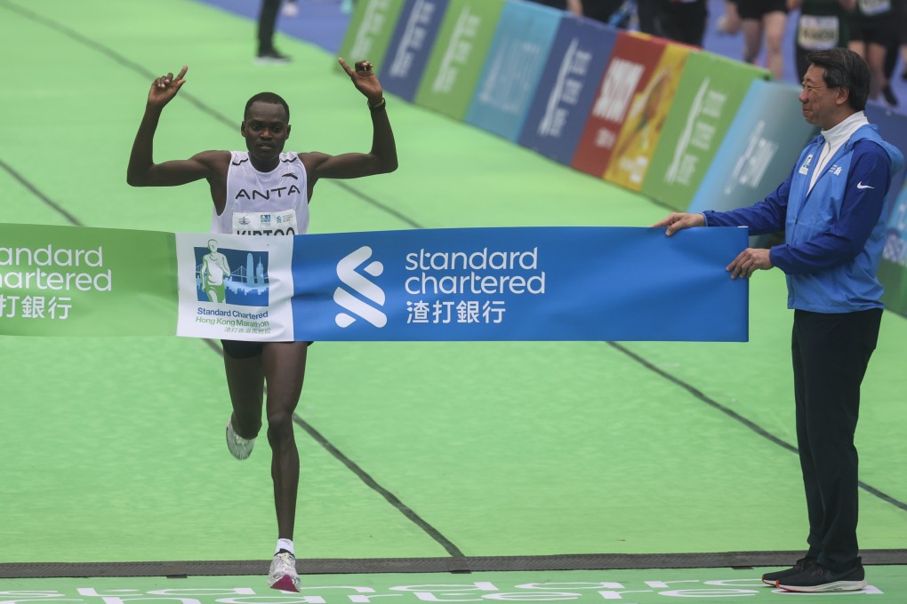 Men’s champion Philimon Kiptoo Kipchumba crosses the finish line to win the 25th Standard Chartered Hong Kong Marathon. Photo: Yik Yeung-man