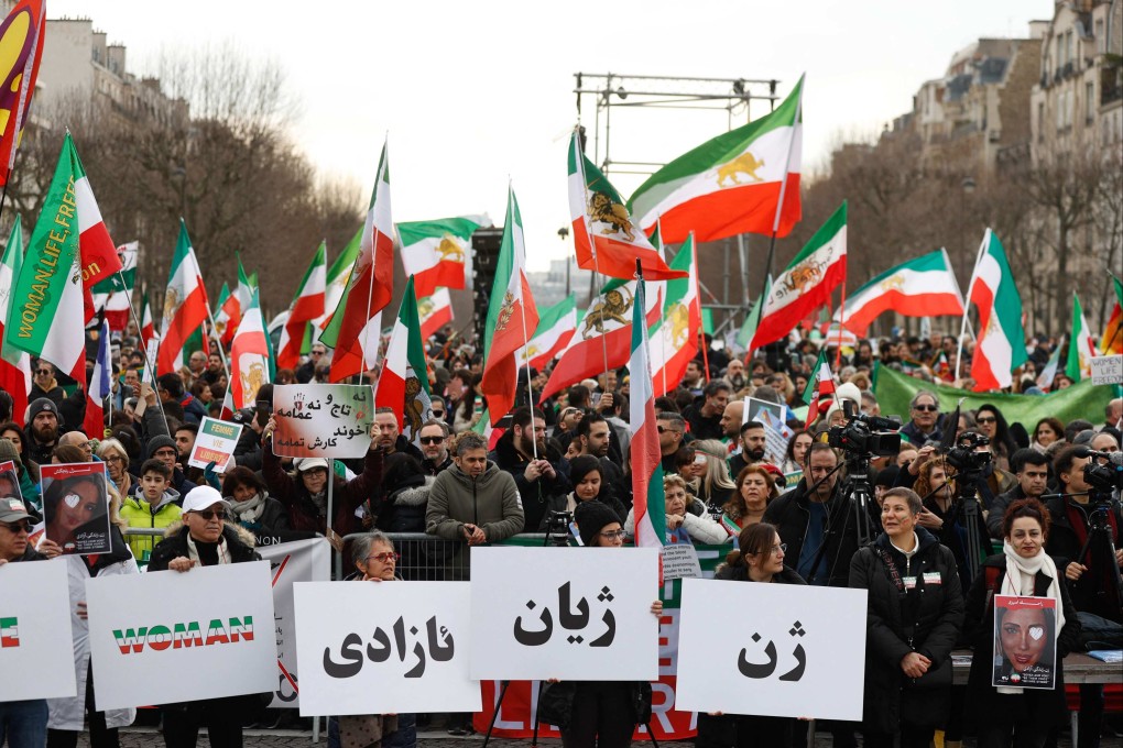 Protesters in Paris, France on Saturday take part in a rally in solidarity with Iranian people on the 44th anniversary of the Islamic Revolution. Photo: AFP / dpa
