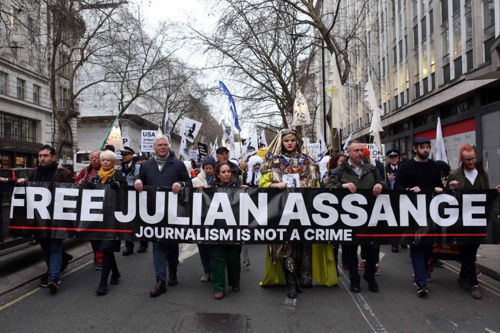 Supporters of WikiLeaks founder Julian Assange take part in a Night Carnival for Assange march in London on Saturday. Photo: AFP