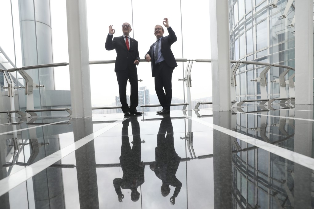 Donald Choi, Chinachem Group executive director and CEO (left) and Alex Keisser, CLPe managing director pose for a photo on February 7, 2023 after signing an agreement to build Hong Kong’s first zero-carbon chiller system in Tsuen Wan. Photo: Xiaomei Chen