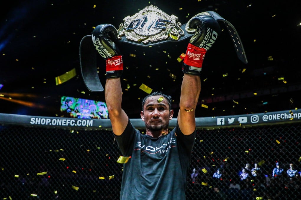 Sam-A Gaiyanghadao hoists the ONE Championship strawweight kickboxing belt. Photos: ONE Championship.