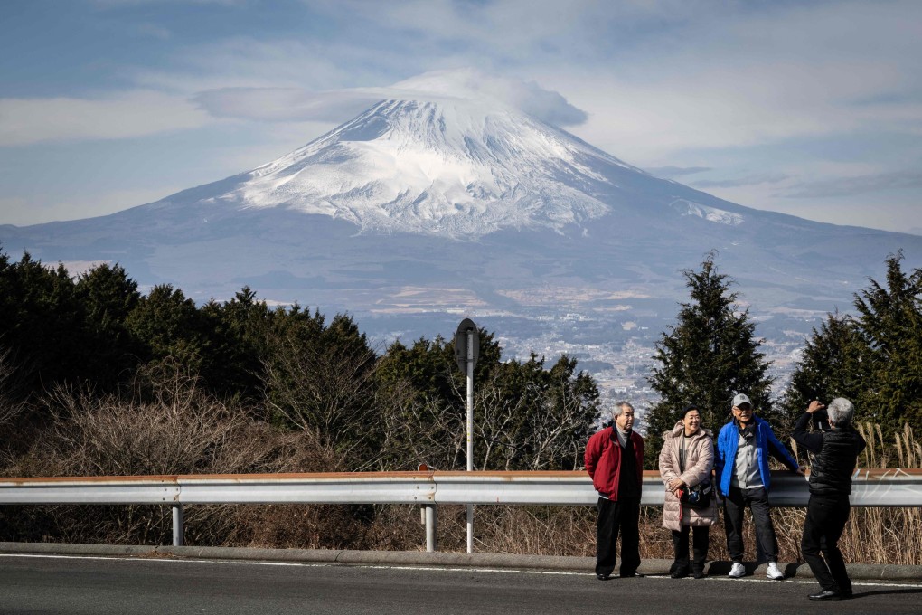 People having their photographs taken in front of Japan’s Mount Fuji in Gotemba city, Shizuoka prefecture. In an encouraging sign, some 3.8 million visitors travelled to Japan last year. Photo: AFP